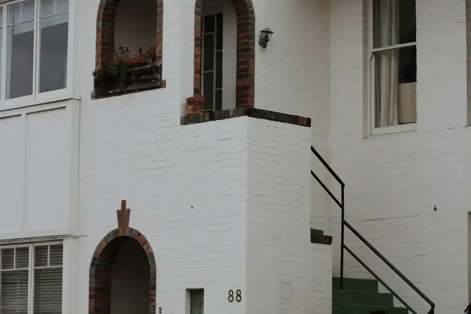 A white apartment block in the sun