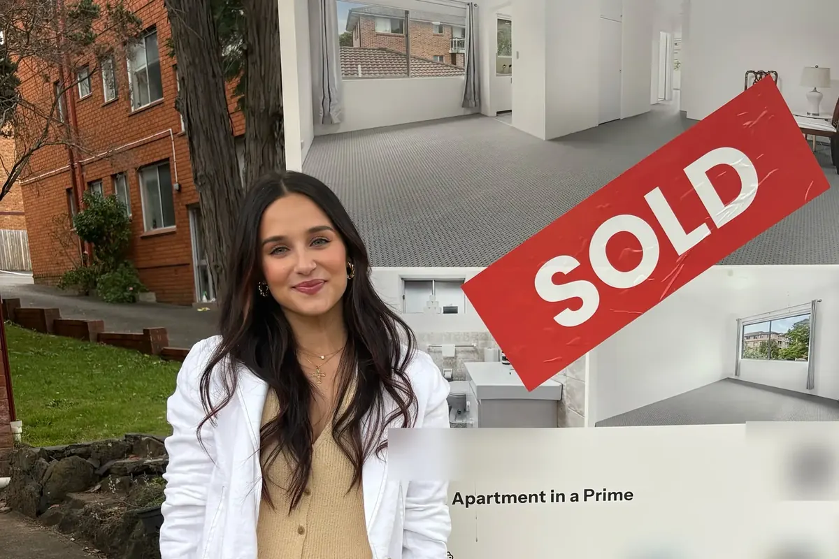 A Links Property Finance client in front of the sold sign at the first home she bought