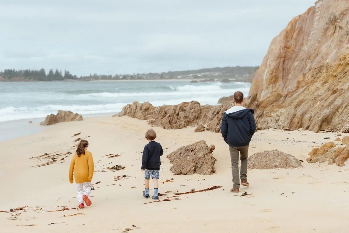 A family walking along a Sydney beach