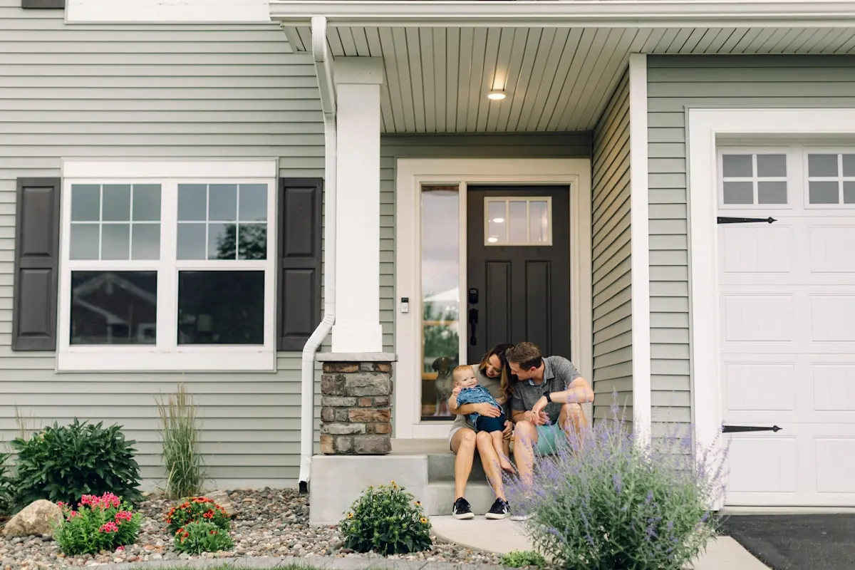 A family on the porch of their home
