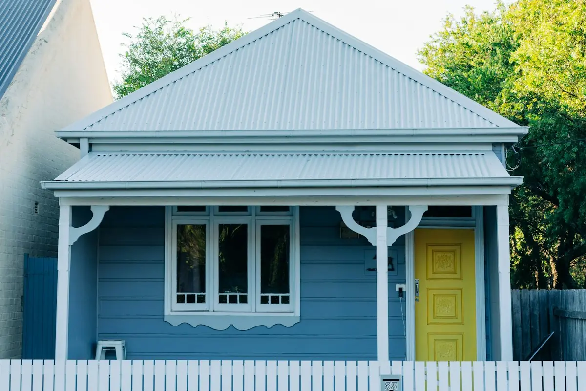 A blue weatherboard cottage