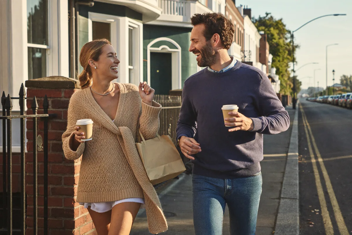 A couple with coffee on a Sydney street